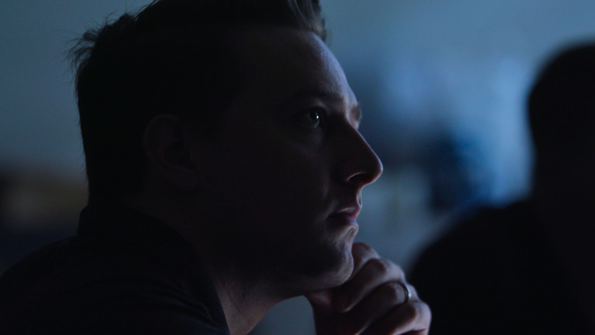 A participant listening during a Caravan workshop