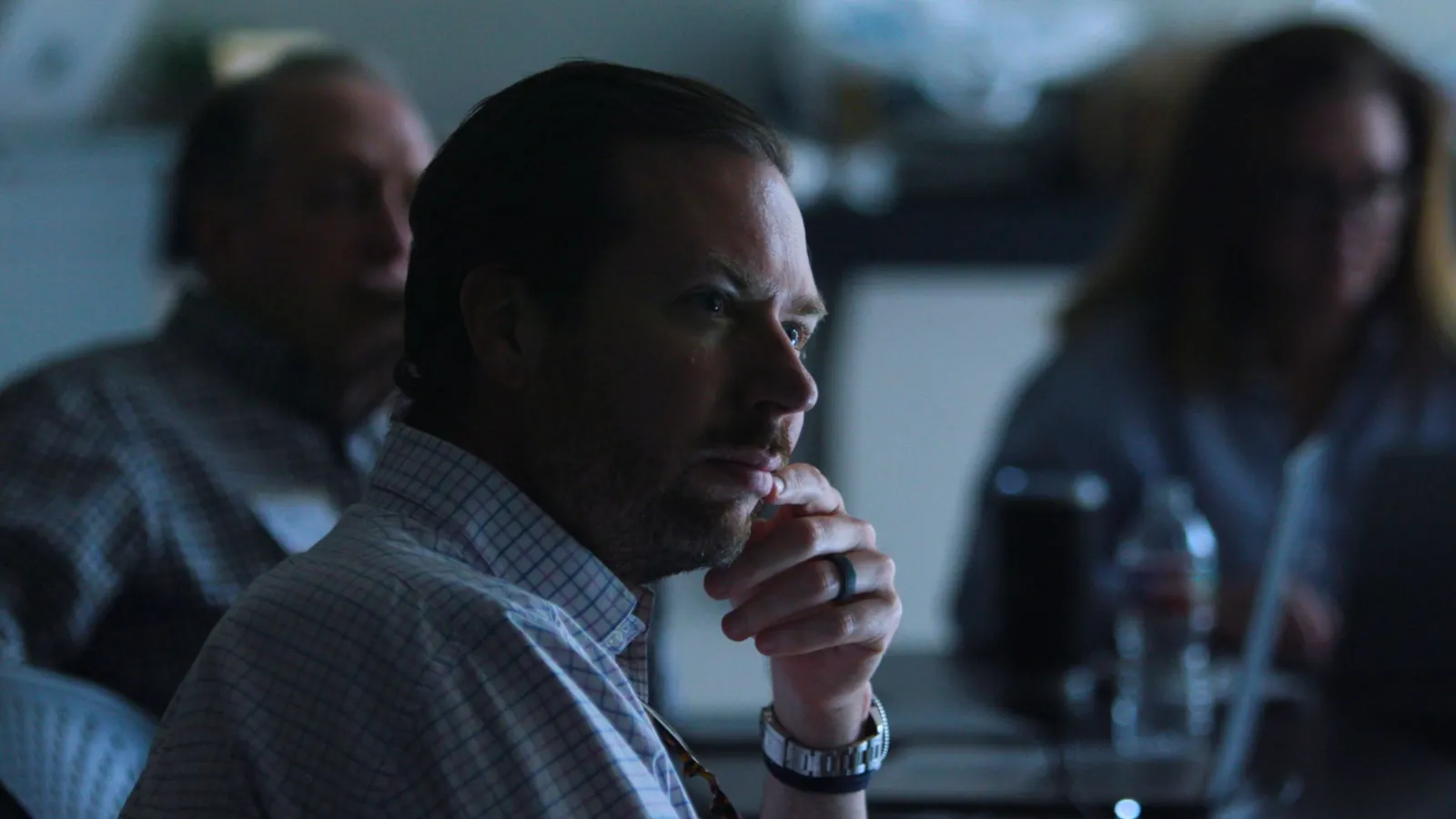 A participant listening during a Caravan workshop