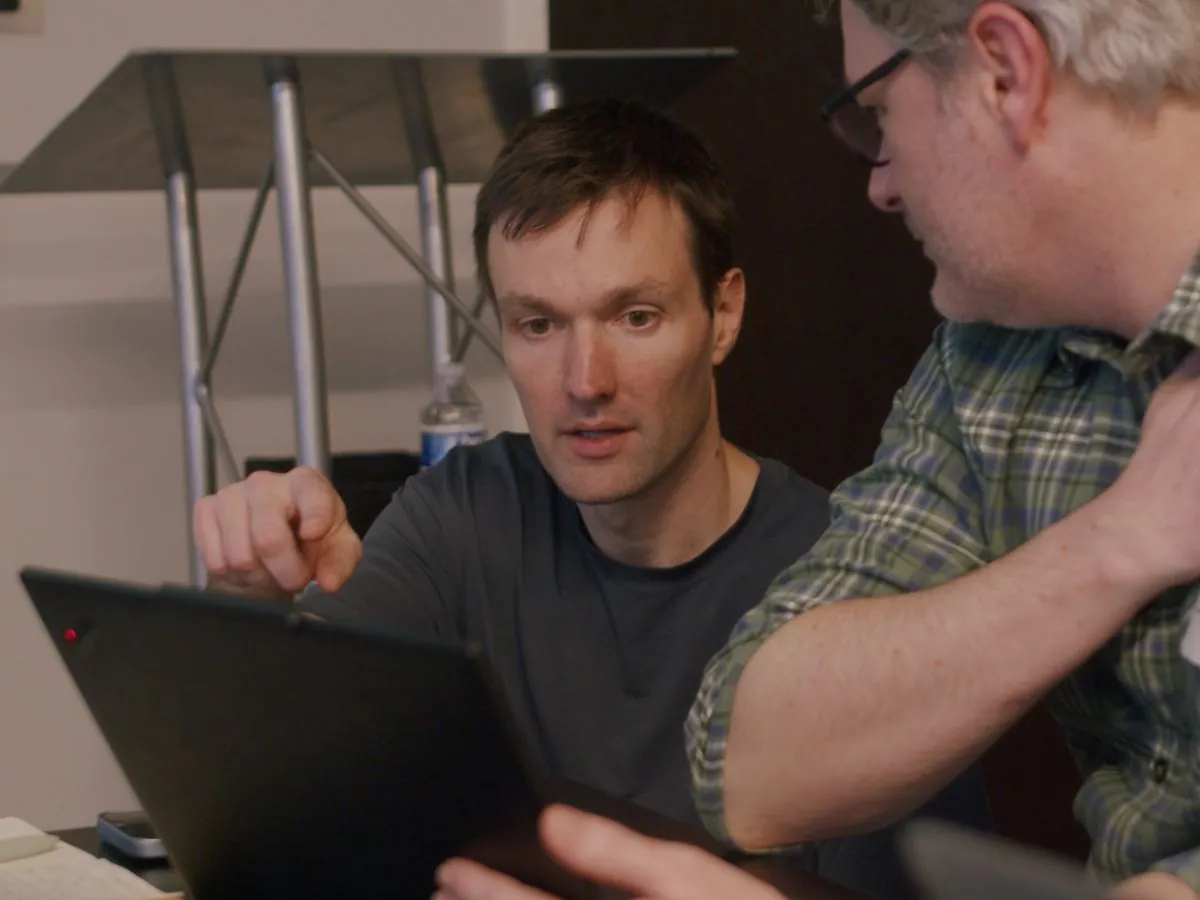A Caravan instructor working through a problem with a participant